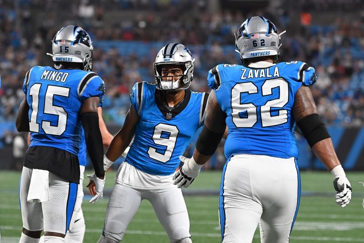Aug 25, 2023; Charlotte, North Carolina, USA; Carolina Panthers quarterback Bryce Young (9) reacts with wide receiver Jonathan Mingo (15) and guard Chandler Zavala (62) after throwing a touchdown pass in the first quarter at Bank of America Stadium.