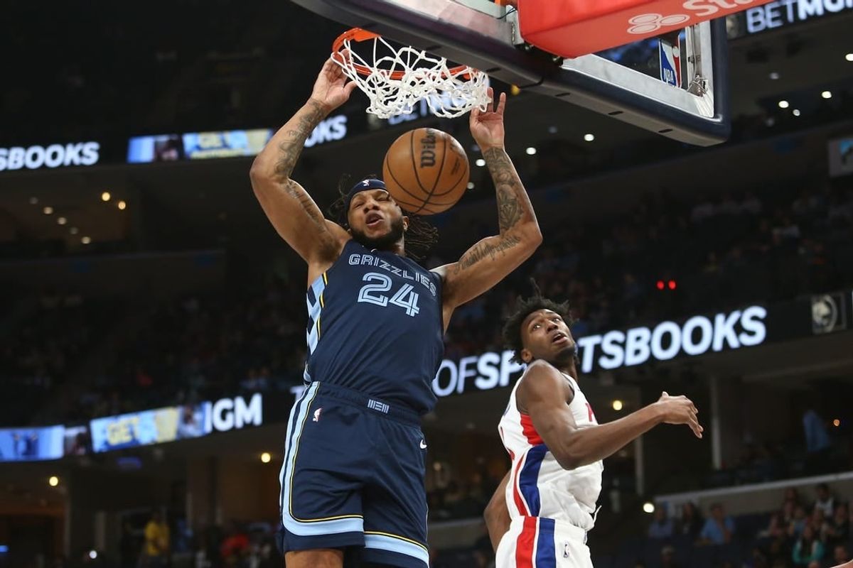 Apr 5, 2024; Memphis, Tennessee, USA; Memphis Grizzlies forward Lamar Stevens (24) dunks over Detroit Pistons center James Wiseman (13) during the first half at FedExForum.
