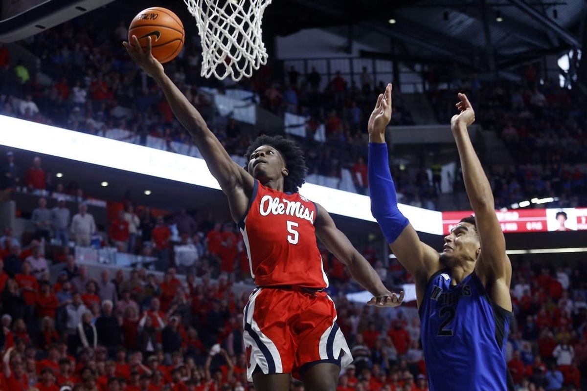 Dec 2, 2023; Oxford, Mississippi, USA; Mississippi Rebels guard Jaylen Murray (5) drives to the basket against Memphis Tigers forward Nicholas Jourdain (2) during the second half at The Sandy and John Black Pavilion at Ole Miss.