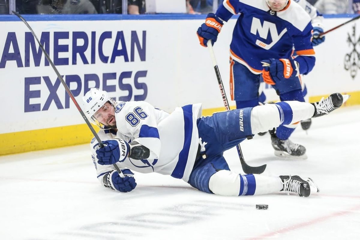 Feb 24, 2024; Elmont, New York, USA;  Tampa Bay Lightning right wing Nikita Kucherov (86) falls on the ice after a collision in the first period against the New York Islanders at UBS Arena.