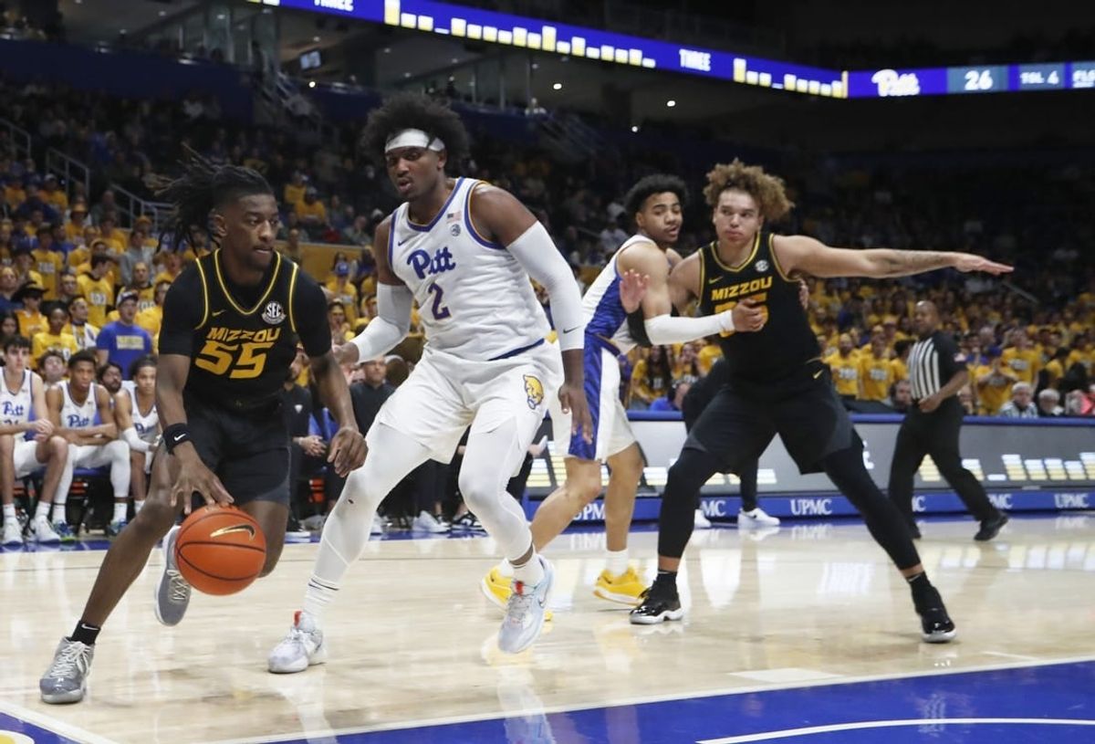 Nov 28, 2023; Pittsburgh, Pennsylvania, USA; Missouri Tigers guard Sean East II (55) drives the baseline against Pittsburgh Panthers forward Blake Hinson (2) during the first half at the Petersen Events Center.