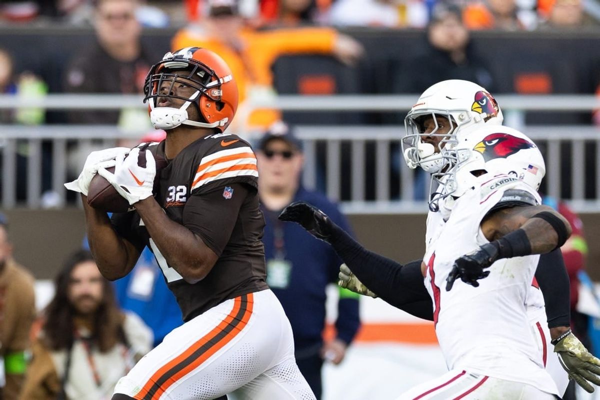 Nov 5, 2023; Cleveland, Ohio, USA; Cleveland Browns wide receiver Amari Cooper (2) makes a reception for a first down under coverage by Arizona Cardinals cornerback Antonio Hamilton Sr. (33) and safety Budda Baker (3) during the fourth quarter at Cleveland Browns Stadium.
