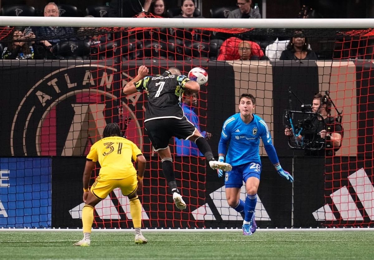 Nov 7, 2023; Atlanta, Georgia, USA; Atlanta United forward Giorgos Giakoumakis (7) scores a goal against Columbus Crew goalkeeper Diego Rossi (28) in the first half at Mercedes-Benz Stadium.