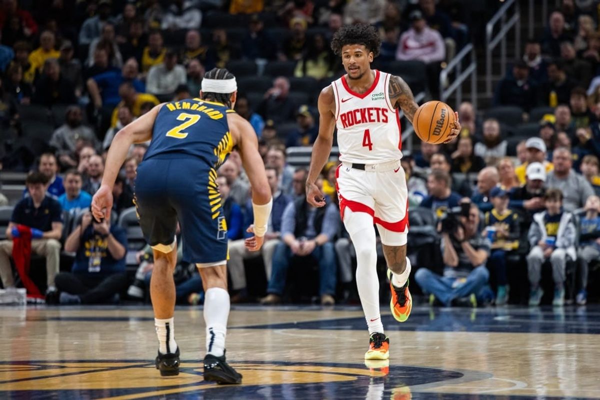 Feb 6, 2024; Indianapolis, Indiana, USA;  Houston Rockets guard Jalen Green (4) dribbles the ball while Indiana Pacers guard Andrew Nembhard (2) defends in the first half at Gainbridge Fieldhouse.