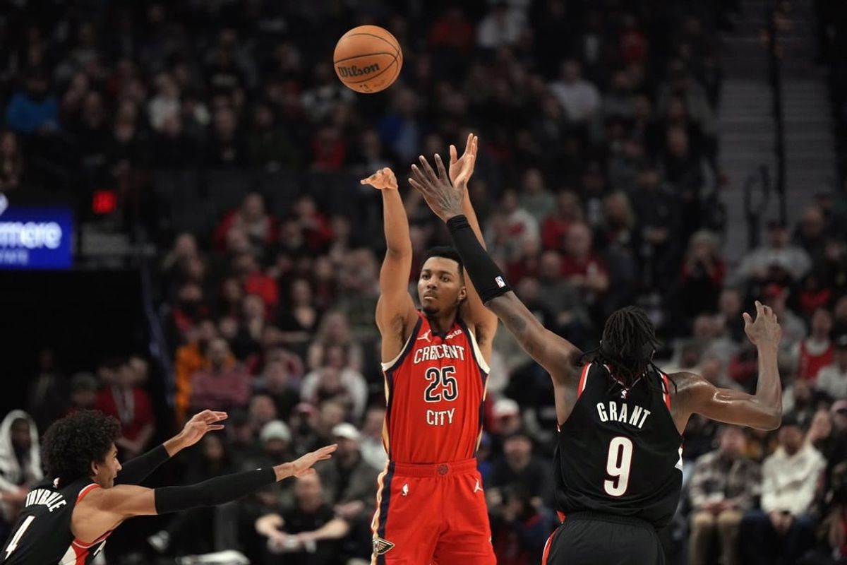 Feb 10, 2024; Portland, Oregon, USA; New Orleans Pelicans shooting guard Trey Murphy III (25) shoots the ball over Portland Trail Blazers small forward Jerami Grant (9) during the first half at Moda Center.