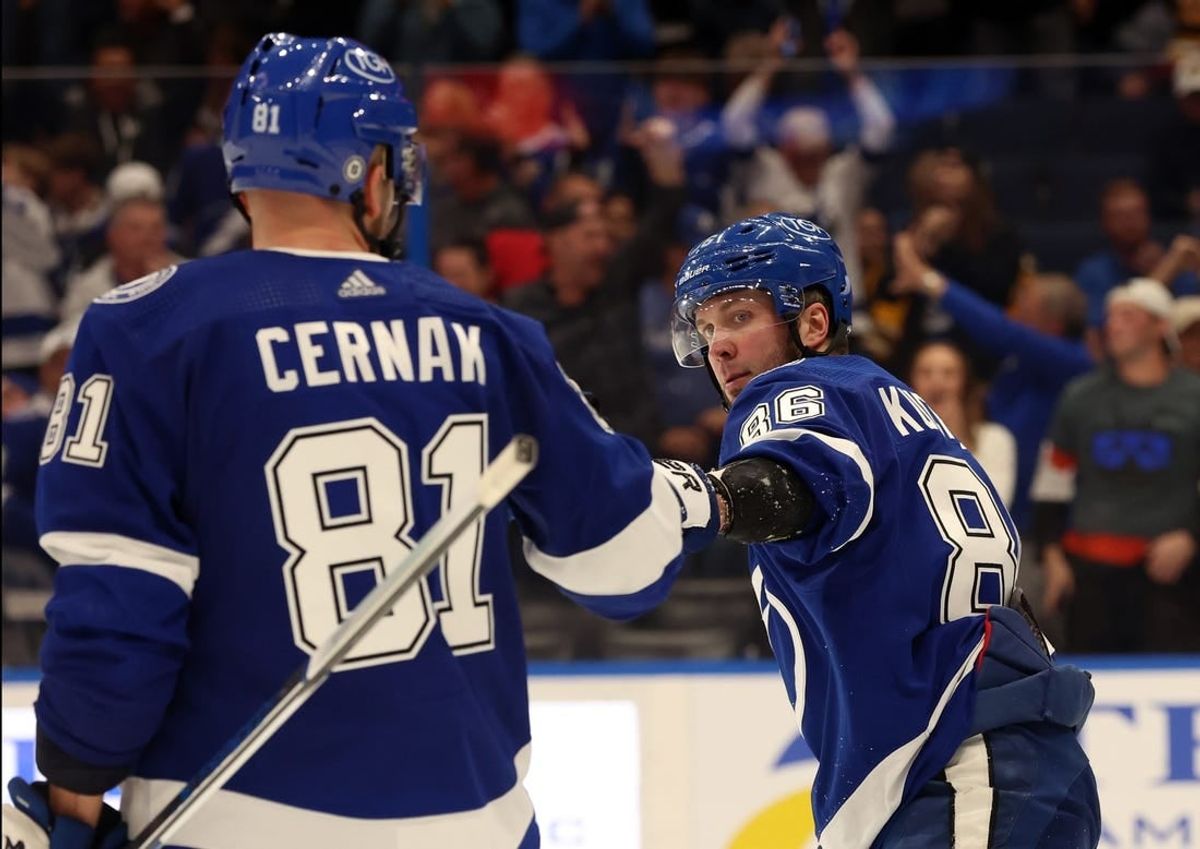 Mar 27, 2024; Tampa, Florida, USA; Tampa Bay Lightning right wing Nikita Kucherov (86) is congratulated after he scored a goal against the Boston Bruins during the third period at Amalie Arena.