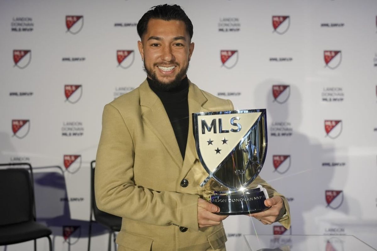 Nov 27, 2023; Cincinnati, OH, USA;  FC Cincinnati   s Luciano Acosta poses for a photo with the Landon Donovan MLS MVP award during a press conference at TQL Stadium.