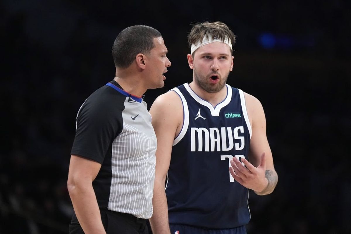 Jan 17, 2024; Los Angeles, California, USA; Dallas Mavericks guard Luka Doncic (77) reacts to a call by referee Nate Green in the second half against the Los Angeles Lakers at Crypto.com Arena.