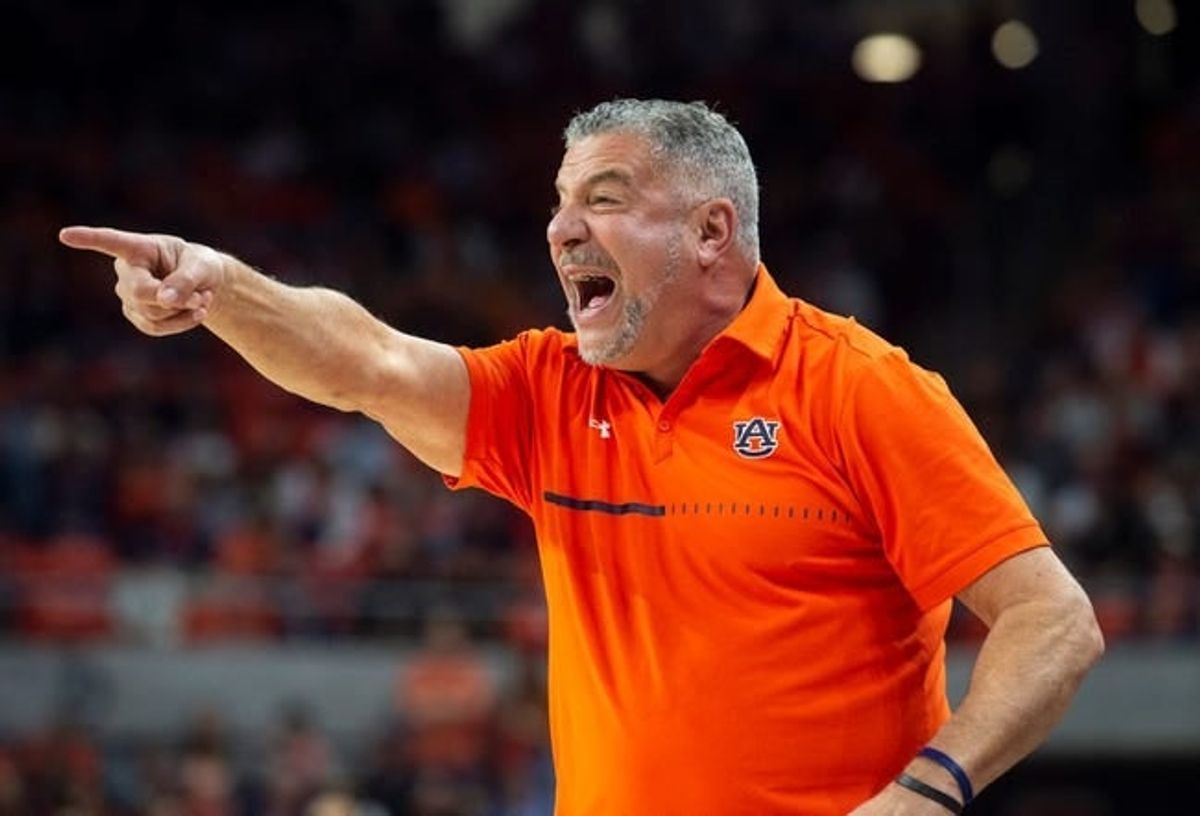 Auburn Tigers head coach Bruce Pearl talks with his team as Auburn Tigers take on Arkansas Razorbacks at Neville Arena in Auburn, Ala., on Saturday, Jan. 7, 2023.