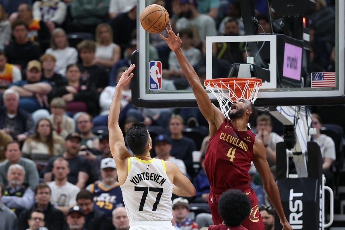 Apr 2, 2024; Salt Lake City, Utah, USA; Cleveland Cavaliers forward Evan Mobley (4) blocks the shot of Utah Jazz center Omer Yurtseven (77) during the second quarter at Delta Center.