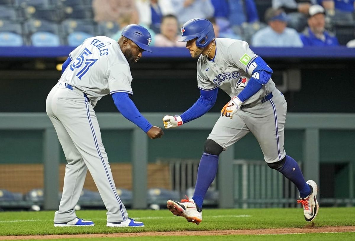 Apr 24, 2024; Kansas City, Missouri, USA; Toronto Blue Jays outfielder George Springer (4) celebrates with third base coach Carlos Febles (51) after hitting a home run during the fifth inning against the Kansas City Royals at Kauffman Stadium.