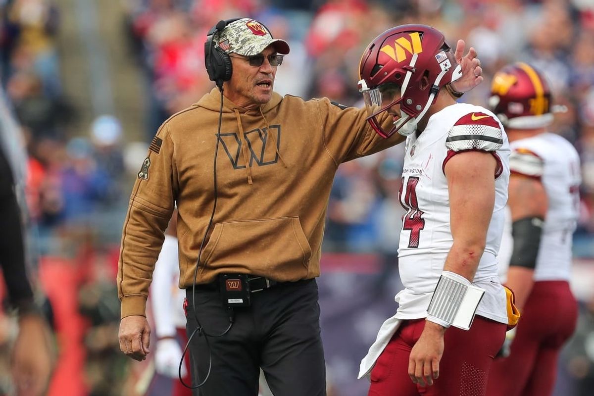 Nov 5, 2023; Foxborough, Massachusetts, USA; Washington Commanders head coach Ron Rivera talks to Washington Commanders quarterback Sam Howell (14) after an interception during the first half against the New England Patriots at Gillette Stadium.