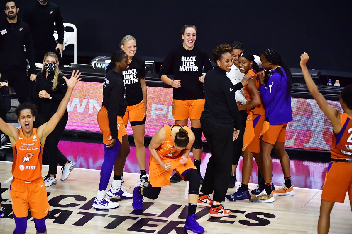 Diana Taurasi and the Phoenix Mercury celebrate their opening night win.