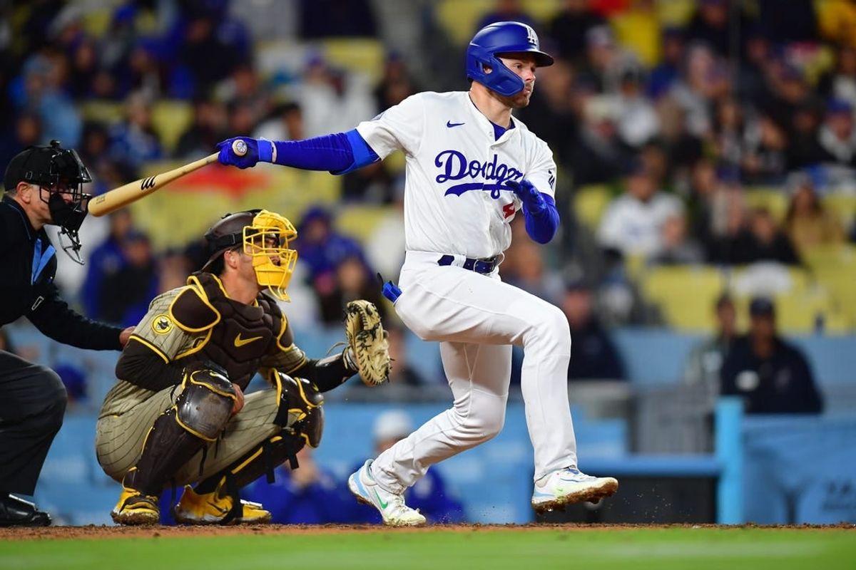 Apr 13, 2024; Los Angeles, California, USA; Los Angeles Dodgers second baseman Gavin Lux (9) hits an RBI single against the San Diego Padres during the sixth inning at Dodger Stadium.