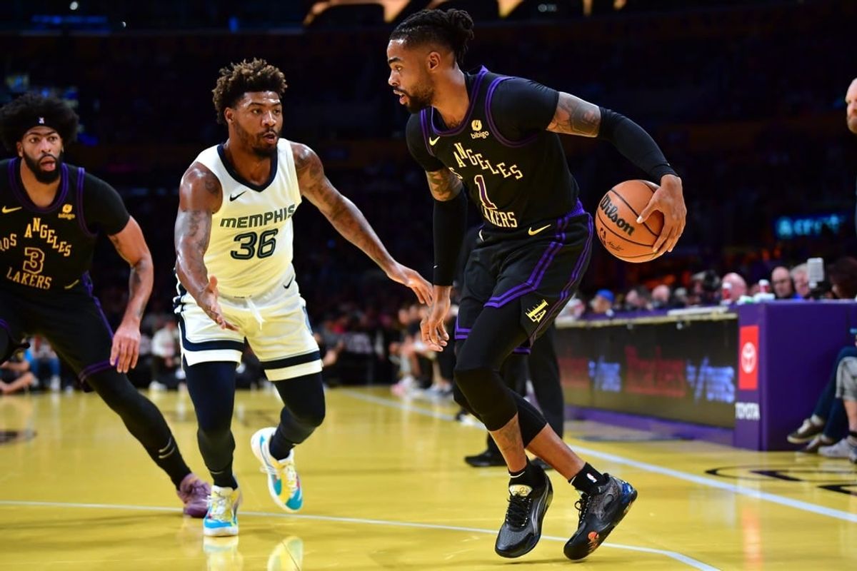 Nov 14, 2023; Los Angeles, California, USA; Los Angeles Lakers guard D   Angelo Russell (1) moves the ball against Memphis Grizzlies guard Marcus Smart (36) during the first half at Crypto.com Arena.