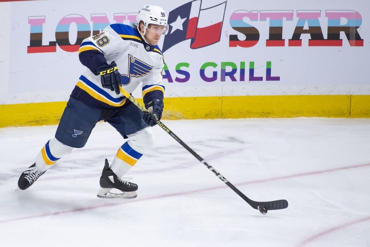 Mar 21, 2024; Ottawa, Ontario, CAN; St. Louis Blues defenseman Scott Perunovich (48) skates with the puck in the third period against the Ottawa Senators at the Canadian Tire Centre.