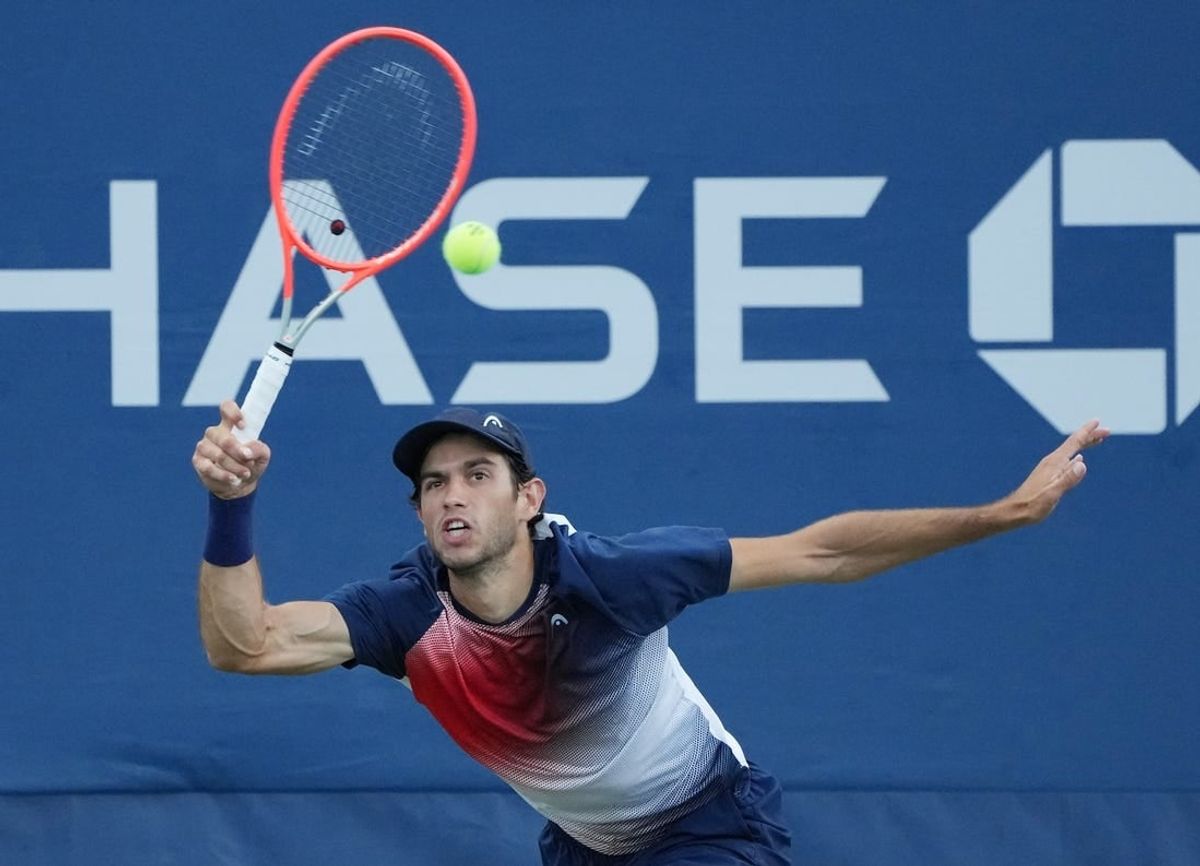 Aug 31, 2022; Flushing, NY, USA;  Nuno Borges of Portugal hits a shot against Yibing Wu of China on day three of the 2022 U.S. Open tennis tournament at USTA Billie Jean King Tennis Center.