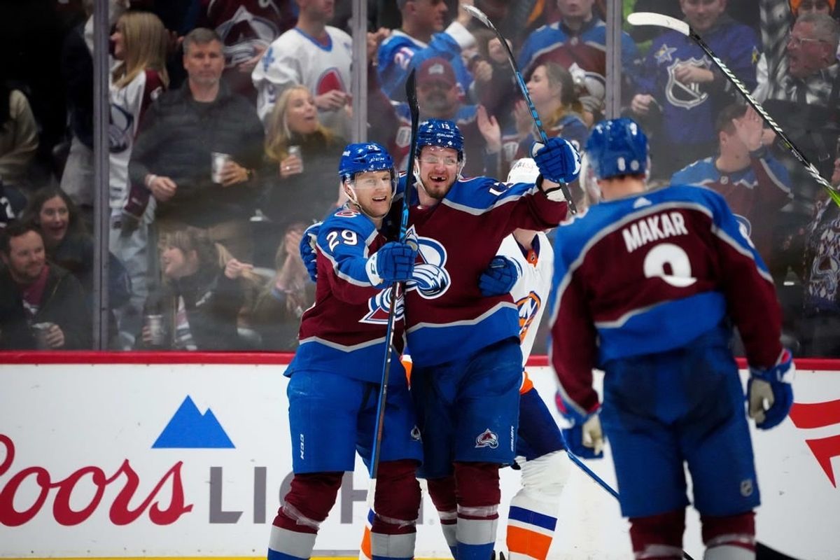 Jan 2, 2024; Denver, Colorado, USA; Colorado Avalanche right wing Valeri Nichushkin (13) celebrates his goal with center Nathan MacKinnon (29) in the third period against the New York Islanders at Ball Arena.