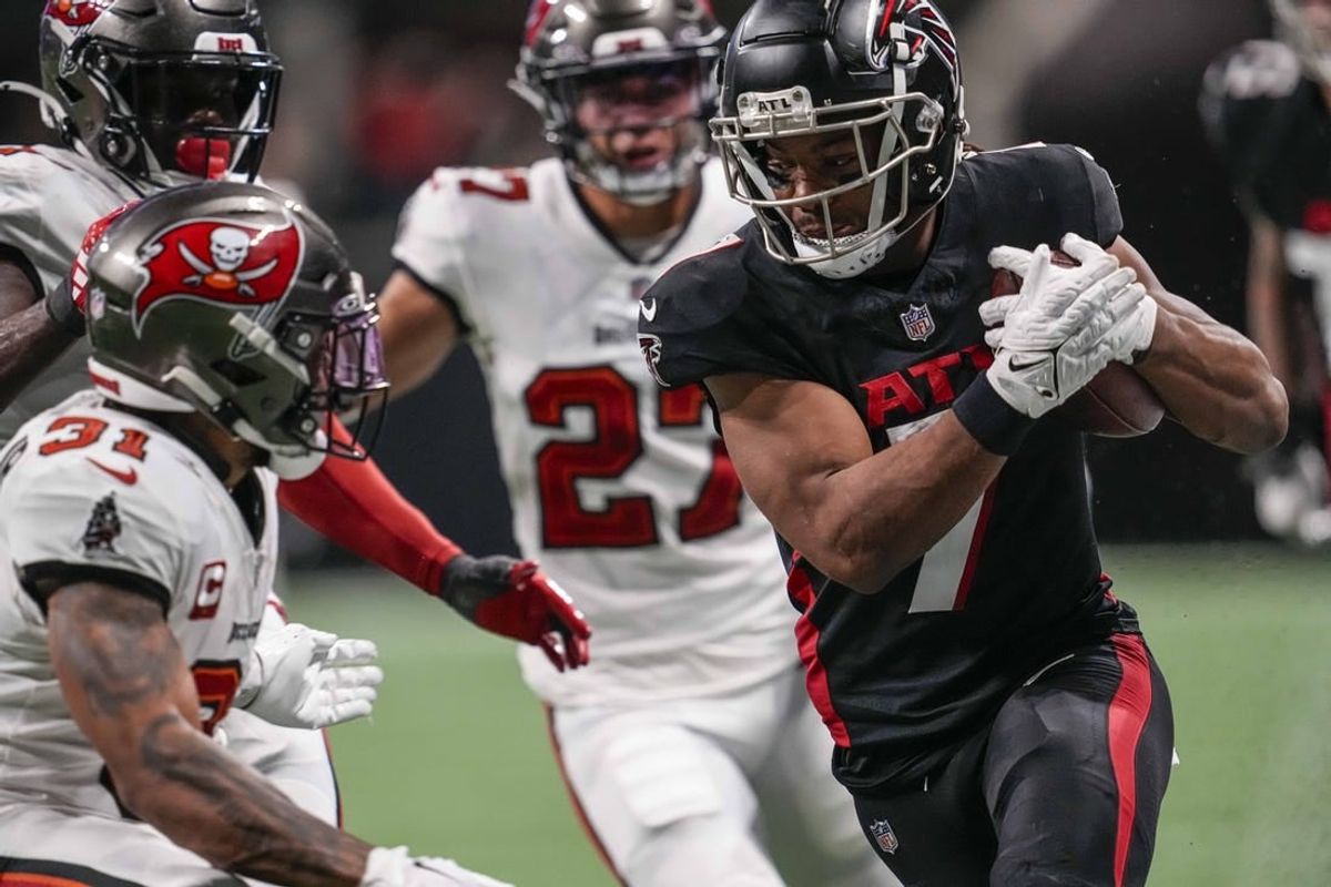 Dec 10, 2023; Atlanta, Georgia, USA; Atlanta Falcons running back Bijan Robinson (7) runs against the Tampa Bay Buccaneers during the second half at Mercedes-Benz Stadium.