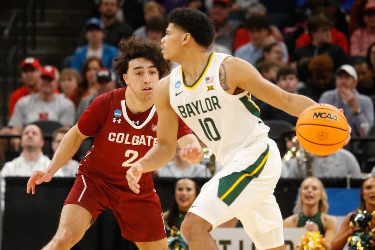 Mar 22, 2024; Memphis, TN, USA;  Baylor Bears guard RayJ Dennis (10) dribbles against Colgate Raiders guard Braeden Smith (2) during the second half of the NCAA Tournament First Round at FedExForum.