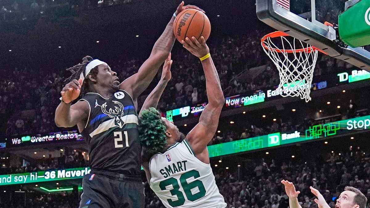 Jrue Holiday blocks Marcus Smart.