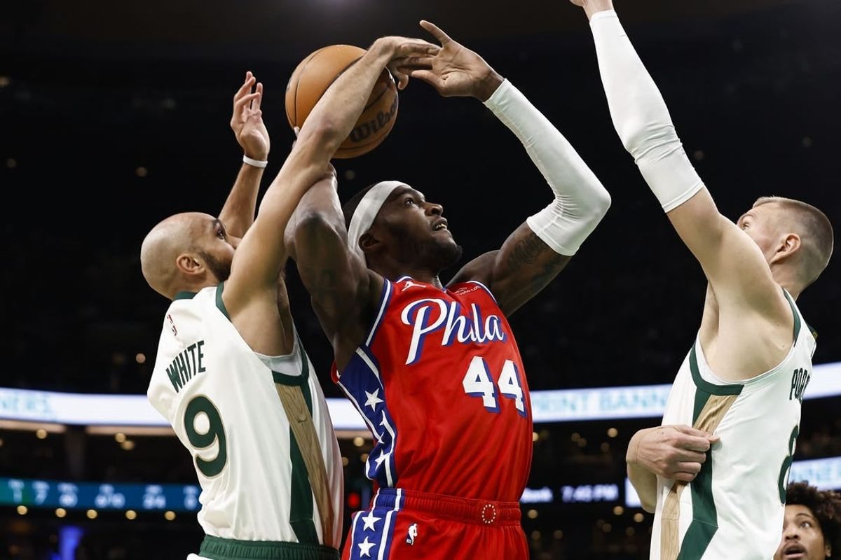 Feb 27, 2024; Boston, Massachusetts, USA; Boston Celtics guard Derrick White (9) knocks the ball away from Philadelphia 76ers forward Paul Reed (44) as he goes for a shot during the first quarter at TD Garden.
