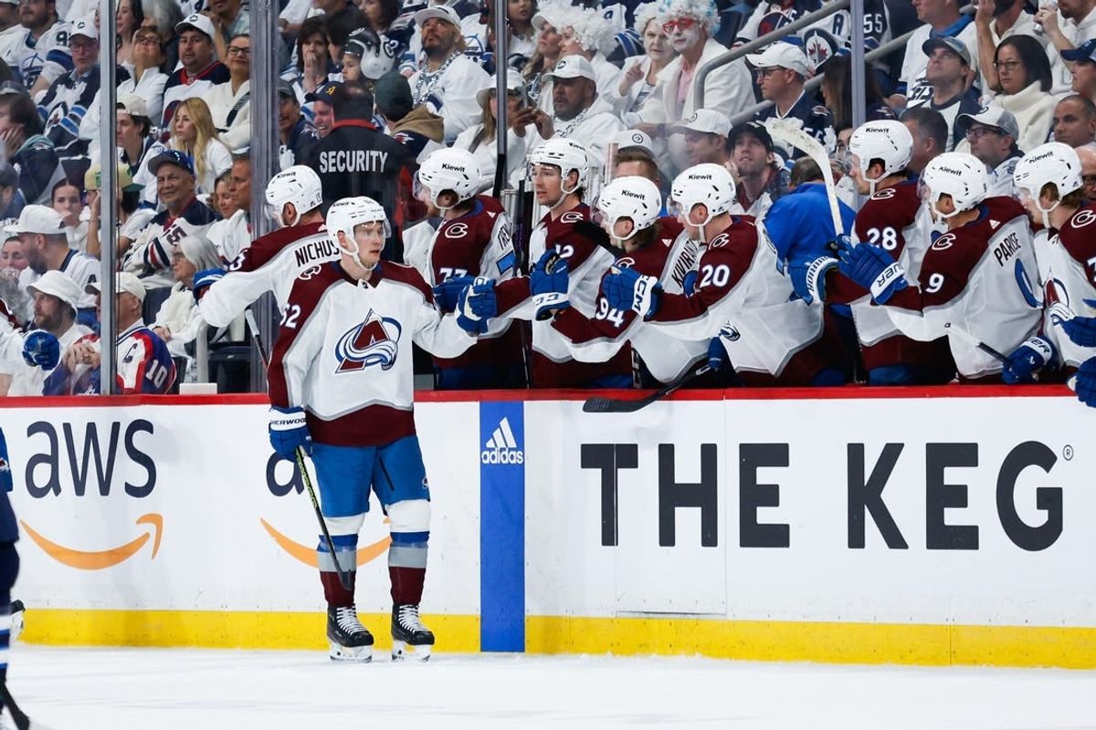 Apr 23, 2024; Winnipeg, Manitoba, CAN; Colorado Avalanche forward Artturi Lehkonen (62) is congratulated by his teammates on his goal against the Winnipeg Jets during the second period in game two of the first round of the 2024 Stanley Cup Playoffs at Canada Life Centre.