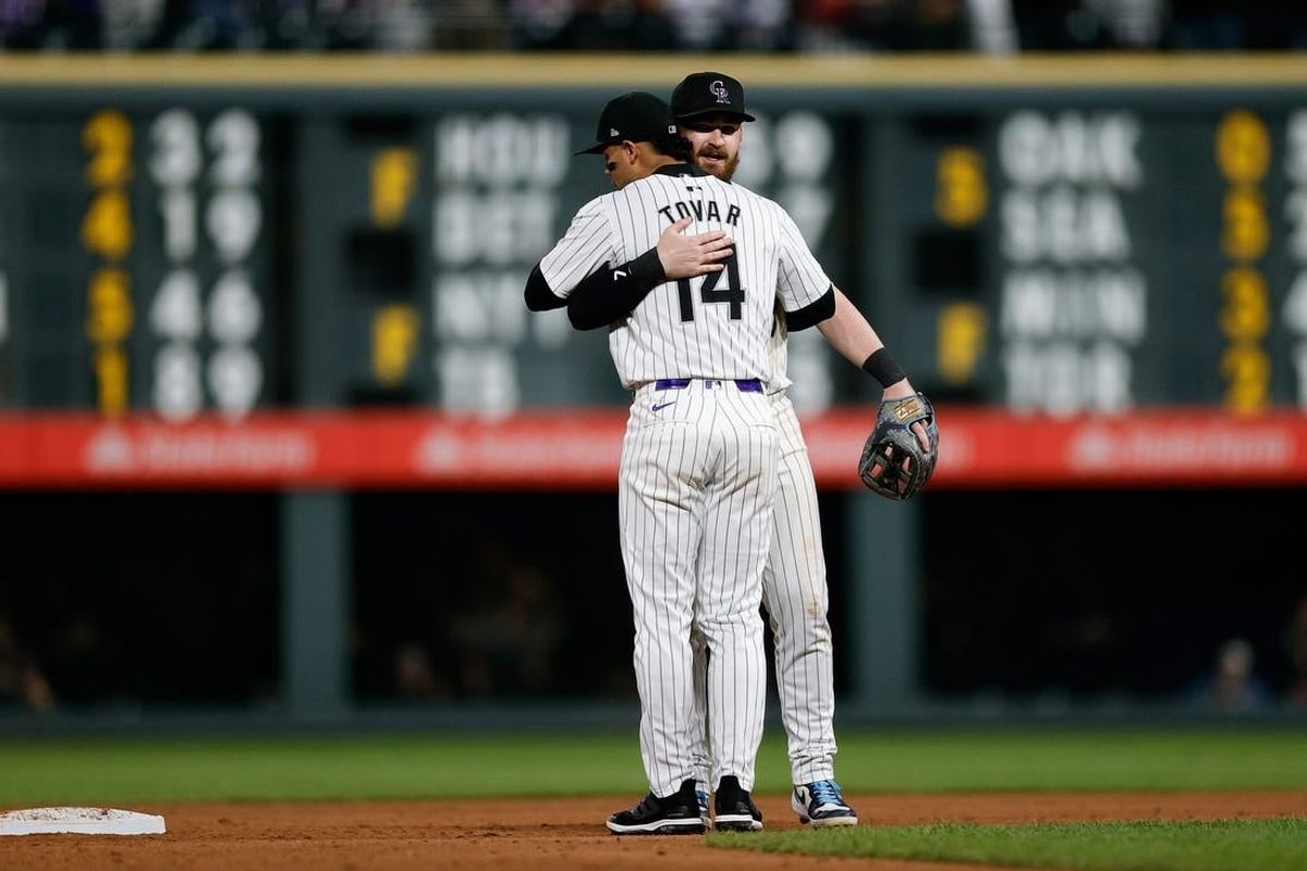 May 10, 2024; Denver, Colorado, USA; Colorado Rockies shortstop Ezequiel Tovar (14) and second baseman Brendan Rodgers (7) react after the game against the Texas Rangers at Coors Field.