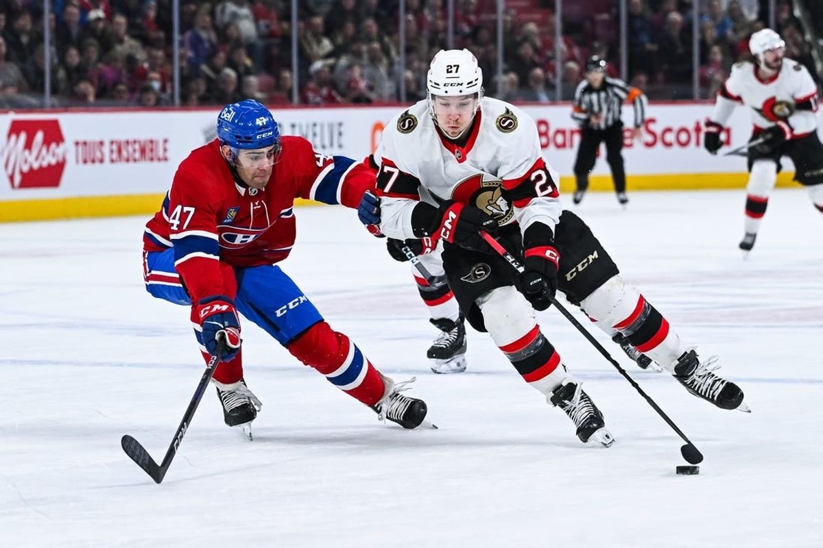 Jan 23, 2024; Montreal, Quebec, CAN; Ottawa Senators left wing Parker Kelly (27) plays the puck against Montreal Canadiens defenseman Jayden Struble (47) during the first period at Bell Centre.