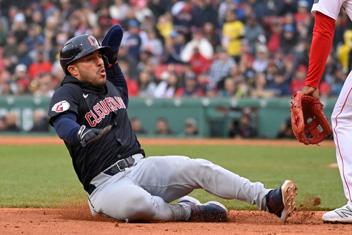 Apr 18, 2024; Boston, Massachusetts, USA; Cleveland Guardians right fielder Ramon Laureano (10) slides into third base during the fifth inning against the Boston Red Sox at Fenway Park.