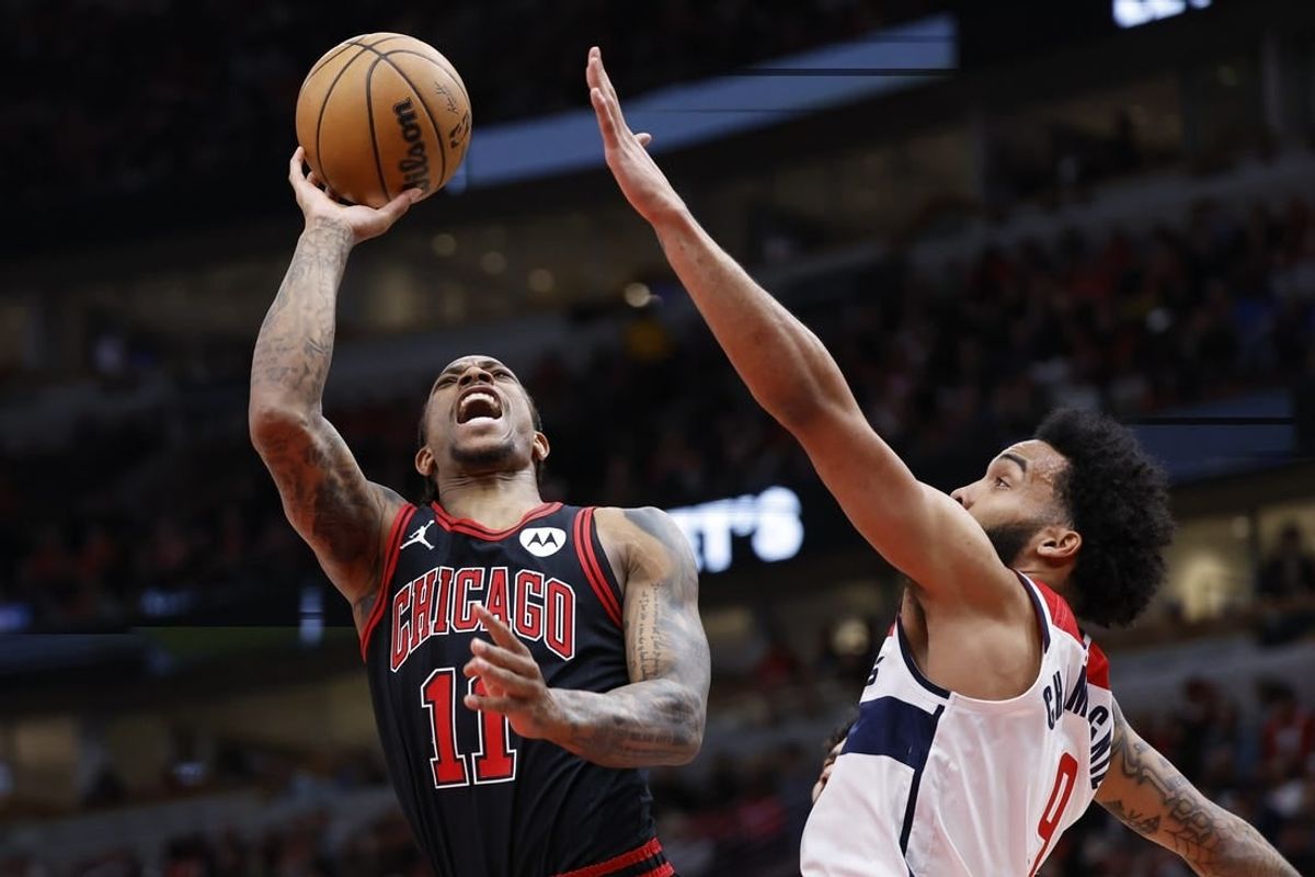 Mar 25, 2024; Chicago, Illinois, USA; Chicago Bulls forward DeMar DeRozan (11) goes to the basket against Washington Wizards forward Justin Champagnie (99) during the first half at United Center.