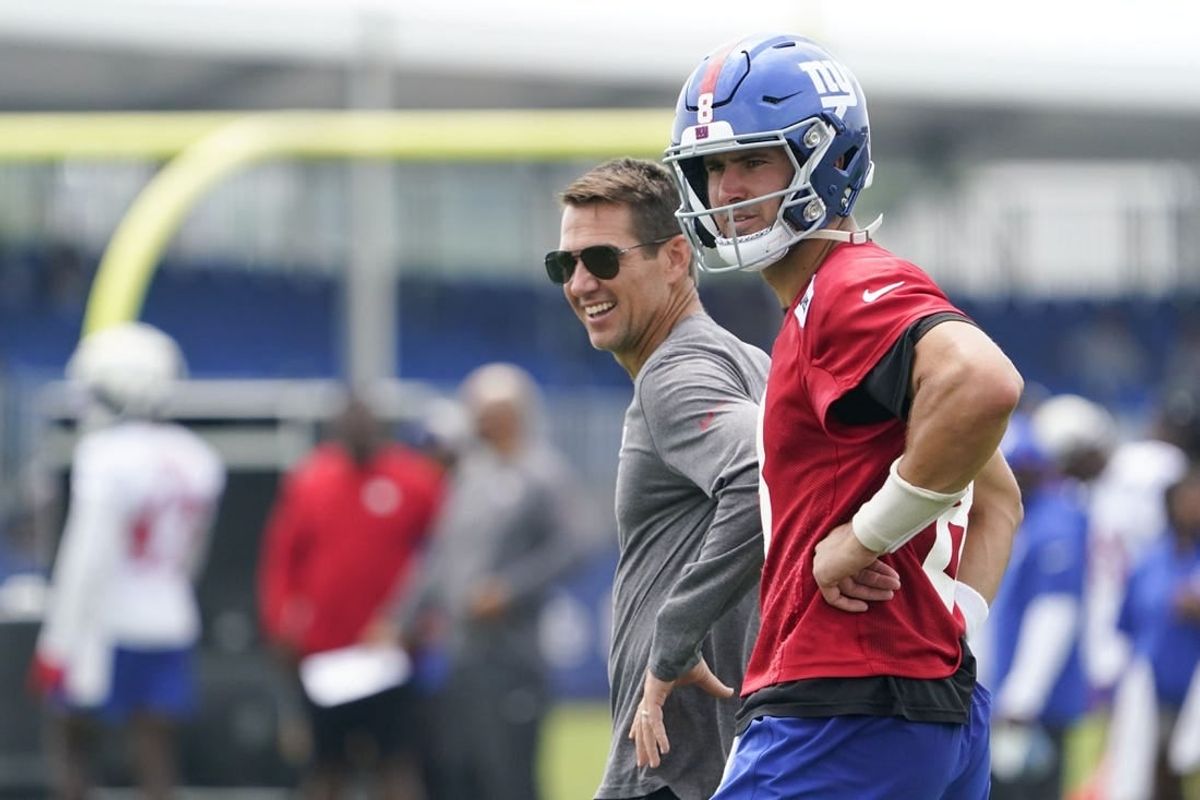 Jul 27, 2023; East Rutherford, NJ, USA;  New York Giants quarterback Daniel Jones (8) and general manager Joe Schoen, left, on day two of training camp at the Quest Diagnostics Training Facility.