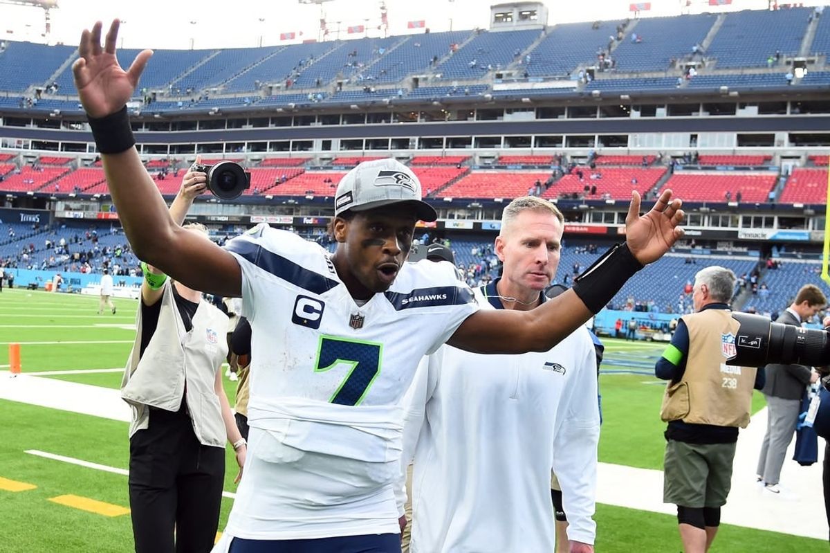 Dec 24, 2023; Nashville, Tennessee, USA; Seattle Seahawks quarterback Geno Smith (7) celebrates as he leaves the field after a win against the Tennessee Titans at Nissan Stadium.