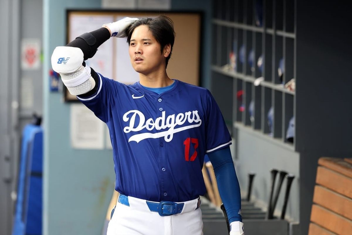 Mar 24, 2024; Los Angeles, California, USA;  Los Angeles Dodgers designated hitter Shohei Ohtani (17) in the dugout prior to the game against the Los Angeles Angels at Dodger Stadium.