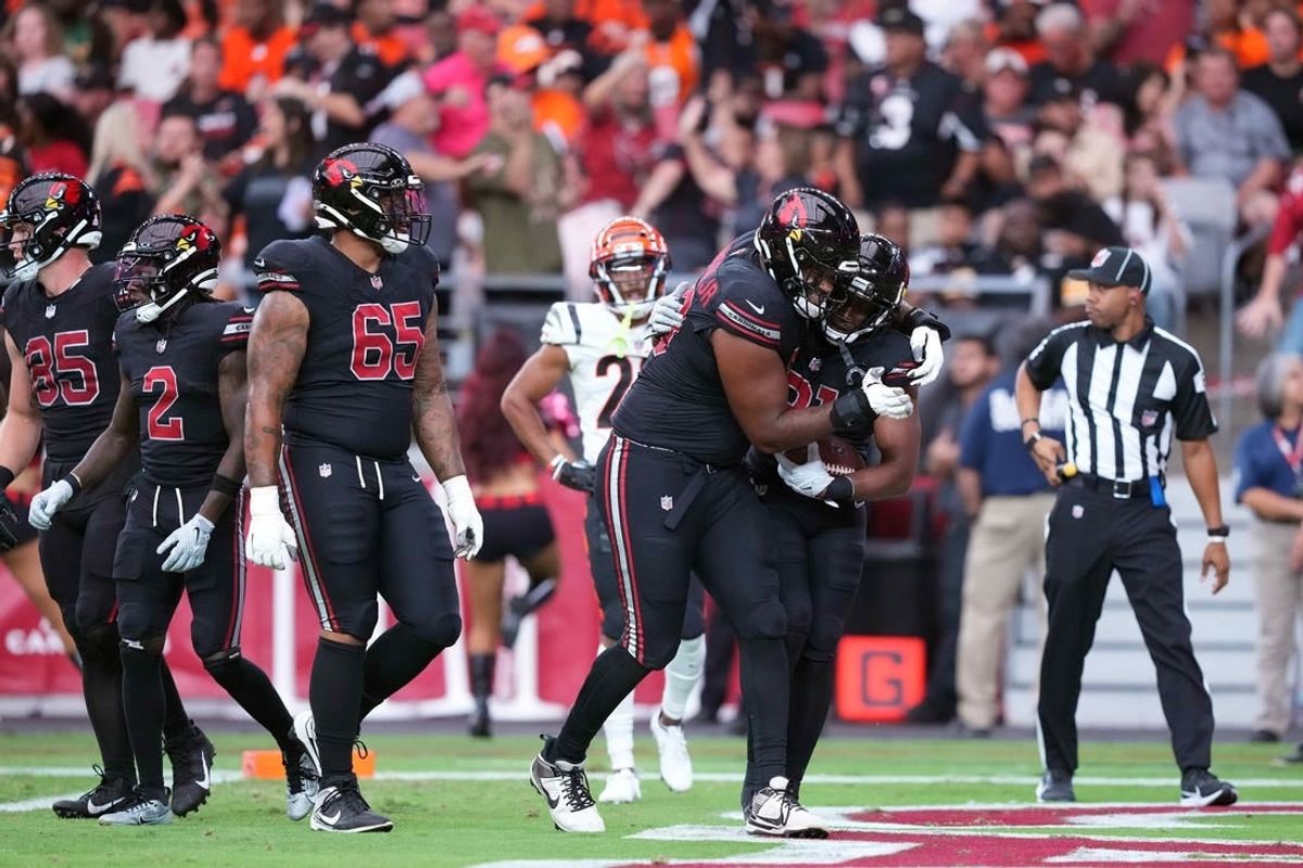 Oct 8, 2023; Glendale, Arizona, USA; Arizona Cardinals running back Emari Demercado (31) celebrates his touchdown with Arizona Cardinals offensive tackle Paris Johnson Jr. (70) during the second half against the Cincinnati Bengals at State Farm Stadium.