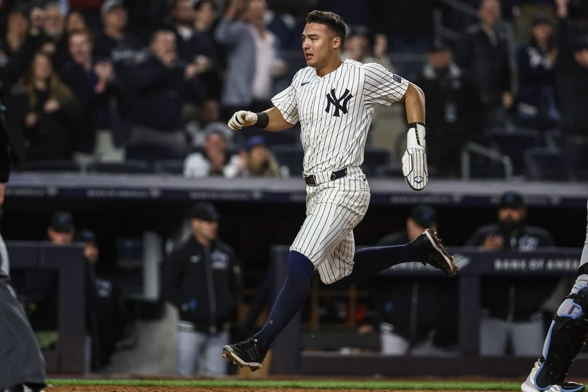 Apr 10, 2024; Bronx, New York, USA;  New York Yankees shortstop Anthony Volpe (11) scores in the eighth inning against the Miami Marlins at Yankee Stadium.