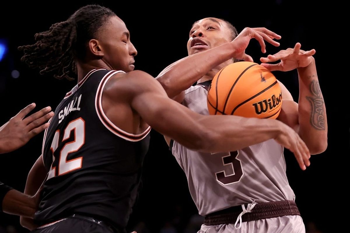 Nov 16, 2023; Brooklyn, New York, USA; Oklahoma State Cowboys guard Javon Small (12) strips the ball from St. Bonaventure Bonnies guard Mika Adams-Woods (3) during the first half at Barclays Center.