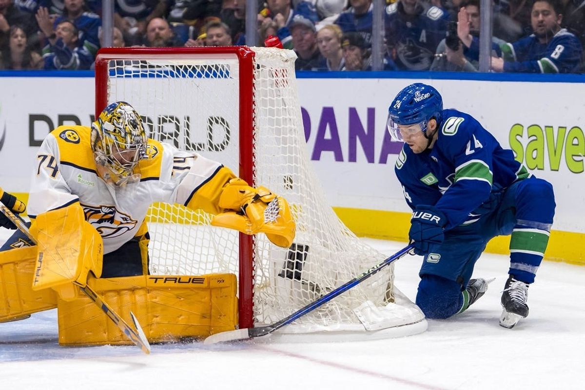 Apr 23, 2024; Vancouver, British Columbia, CAN; Nashville Predators goalie Juuse Saros (74) makes a save on Vancouver Canucks forward Pius Suter (24) during the third period in game two of the first round of the 2024 Stanley Cup Playoffs at Rogers Arena.