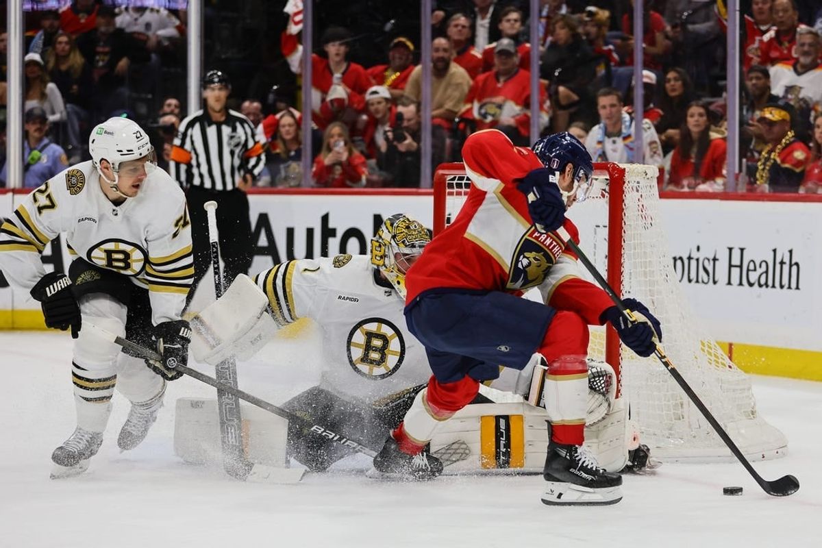 May 8, 2024; Sunrise, Florida, USA; Florida Panthers center Carter Verhaeghe (23) shoots the puck against Boston Bruins goaltender Jeremy Swayman (1) during the first period in game two of the second round of the 2024 Stanley Cup Playoffs at Amerant Bank Arena.