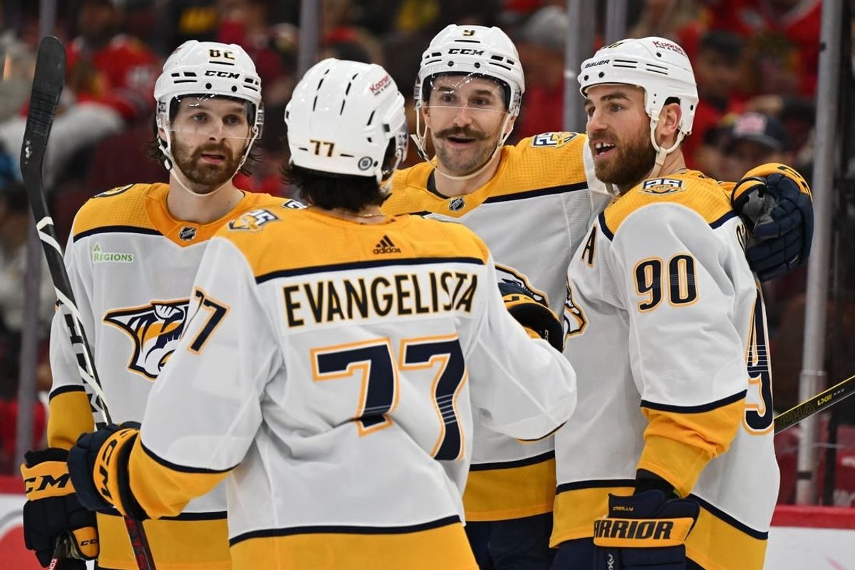 Apr 12, 2024; Chicago, Illinois, USA; Nashville Predators forward Filip Forsberg (9), center, celebrates with teammates forward Thomas Novak (82), forward Luke Evangelista (77), and forward Ryan O'Reilly (90) after scoring his third goal of the game in the third period against the Chicago Blackhawks at United Center.