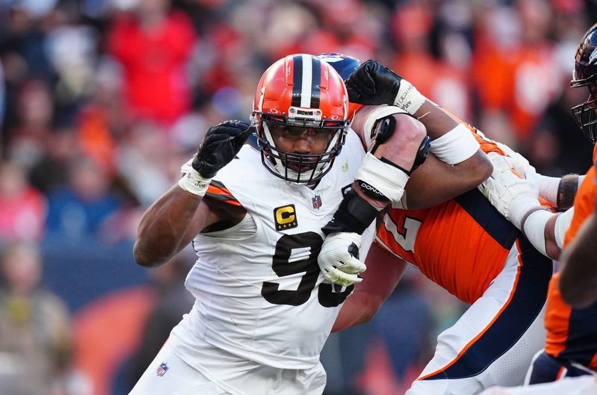 Nov 26, 2023; Denver, Colorado, USA; Cleveland Browns defensive end Myles Garrett (95) rushes past Denver Broncos offensive tackle Garett Bolles (72) in the first half at Empower Field at Mile High.