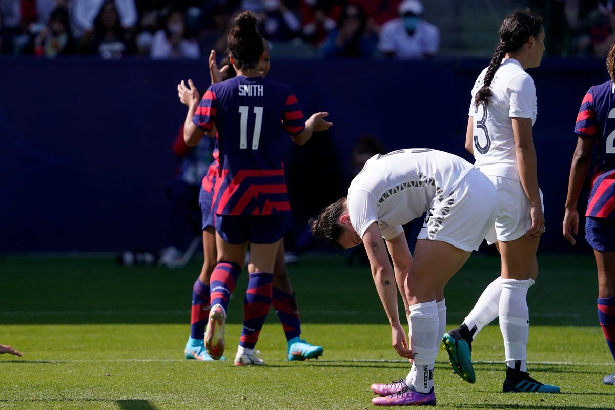 Rough outing for New Zealand’s Meikayla Moore (center, slumped over).