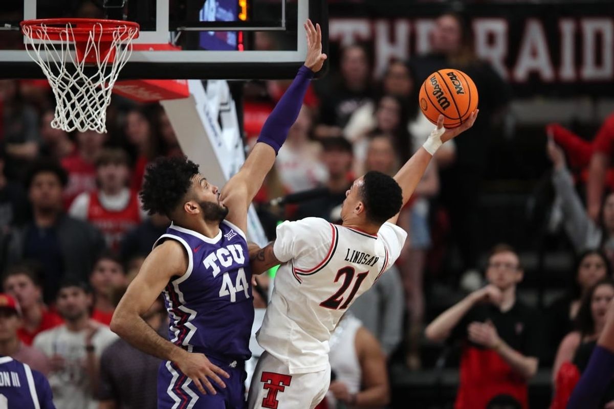 Feb 20, 2024; Lubbock, Texas, USA;  Texas Tech Red Raiders forward KyeRon Lindsey (21) shoots against TCU Horned Frogs forward Essam Mostafa (44) in the first half at United Supermarkets Arena.
