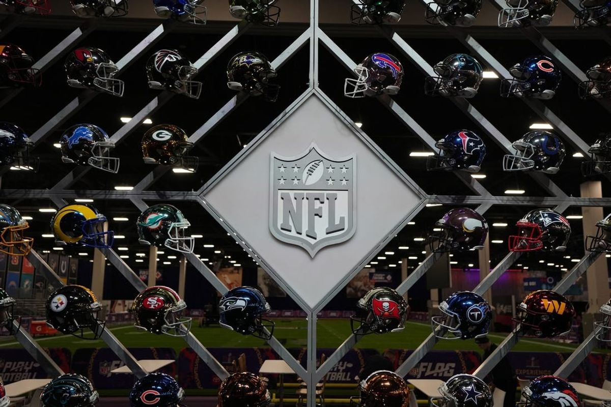 Feb 6, 2024; Las Vegas, NV, USA; The NFL shield logo and helmets at the NFL Experience at the Mandalay Bay resort and casino.