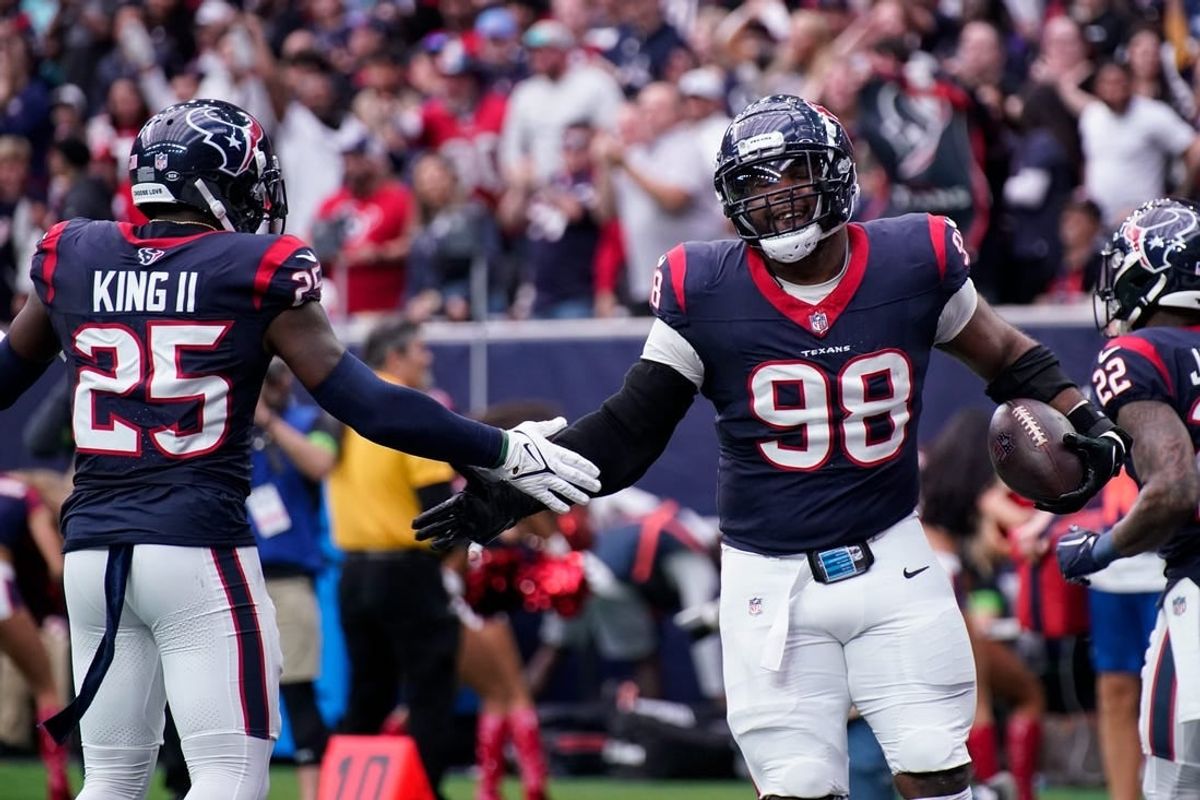 Houston Texans defensive tackle Sheldon Rankins (98) celebrates his touchdown off a ball fumbled by Tennessee Titans quarterback Will Levis during the second quarter at NRG Stadium in Houston, Texas., Sunday, Dec. 31, 2023.