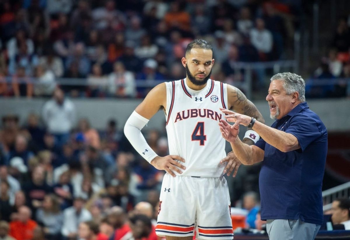 Auburn Tigers head coach Bruce Pearl talks with forward Johni Broome (4) as Auburn Tigers takes on Ole Miss Rebels at Neville Arena in Auburn, Ala., on Saturday, Jan. 20, 2024. Auburn Tigers defeated Ole Miss Rebels 82-59.