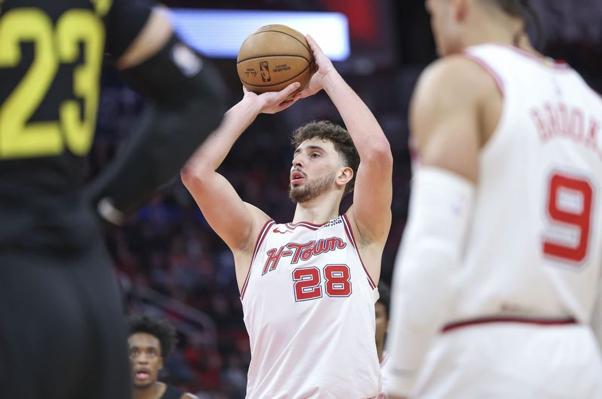 Jan 20, 2024; Houston, Texas, USA; Houston Rockets center Alperen Sengun (28) attempts a free throw during the fourth quarter against the Utah Jazz at Toyota Center.