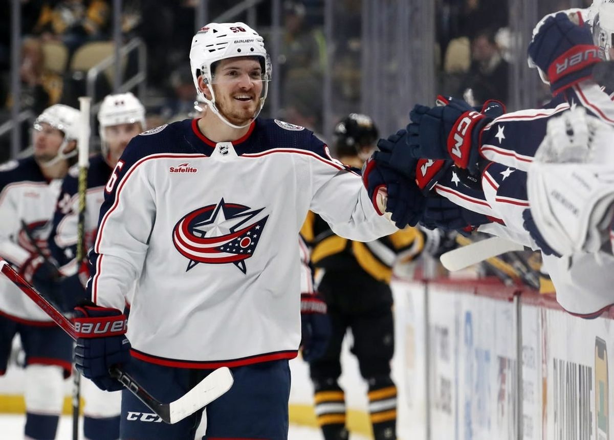 Mar 5, 2024; Pittsburgh, Pennsylvania, USA; Columbus Blue Jackets center Jack Roslovic (96) celebrates with the Blue Jackets bench after scoring a goal against the Pittsburgh Penguins during the third period at PPG Paints Arena. The Penguins won 5-3.