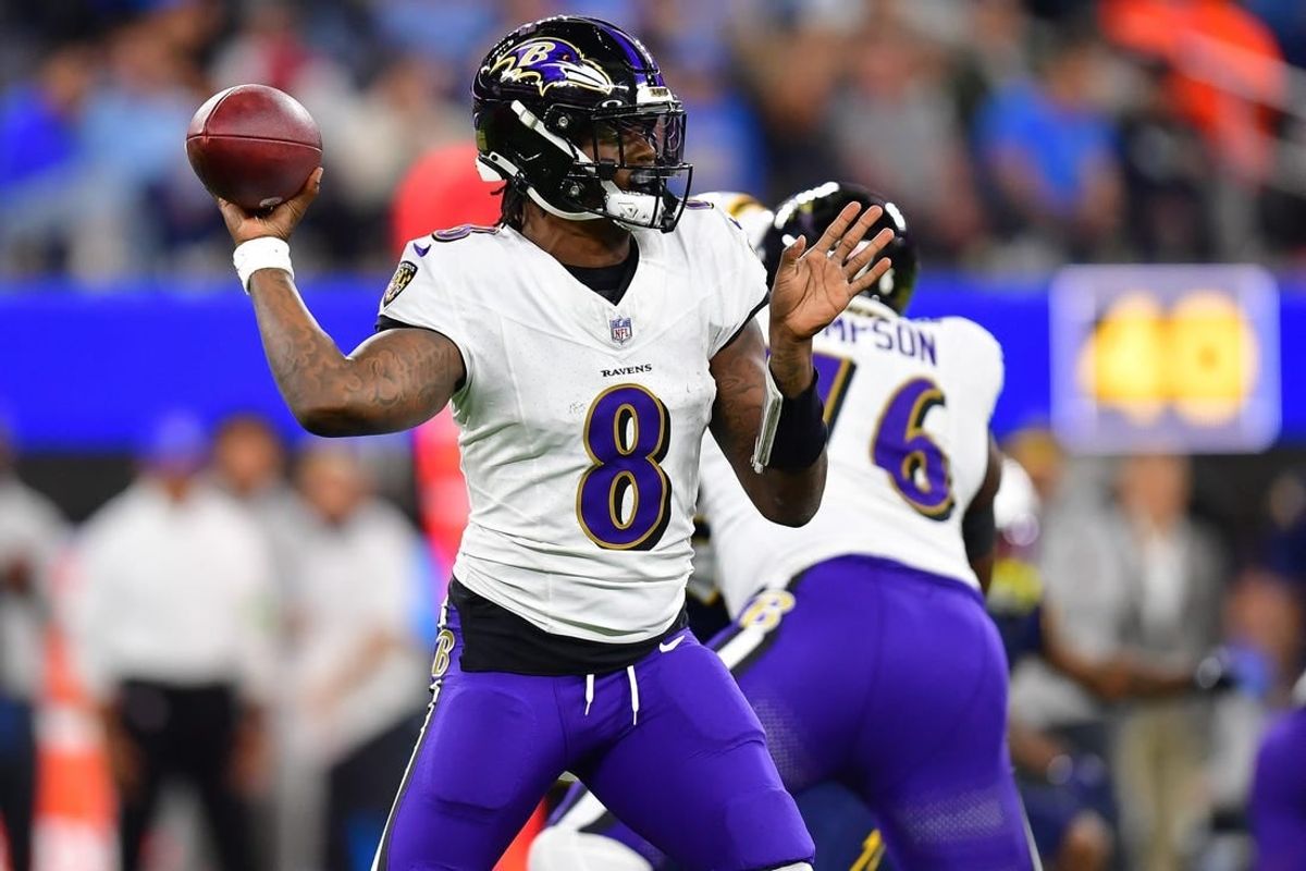Nov 26, 2023; Inglewood, California, USA; Baltimore Ravens quarterback Lamar Jackson (8) throws against the Los Angeles Chargers during the first half at SoFi Stadium.
