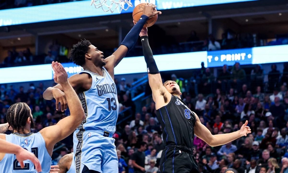 Dec 1, 2023; Dallas, Texas, USA; Memphis Grizzlies forward Jaren Jackson Jr. (13) blocks the shot of Dallas Mavericks guard Josh Green (8) during the second quarter at American Airlines Center.
